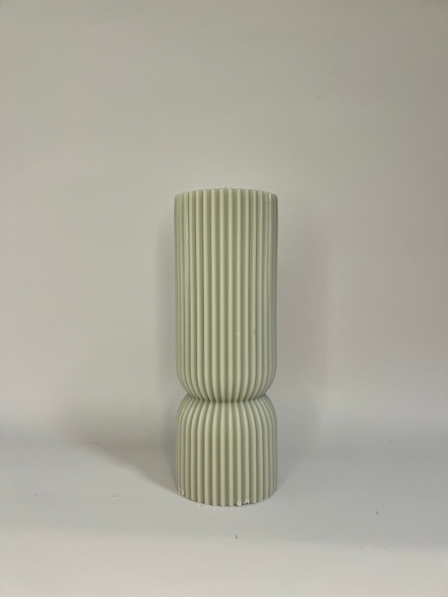 “Luxury soy wax candle trio with two book-shaped candles in beige and blue inspired by Baccarat Rouge 540, and one gray pillar candle with Millionaire Man scent – handmade sculptural candles for home decor and gifting