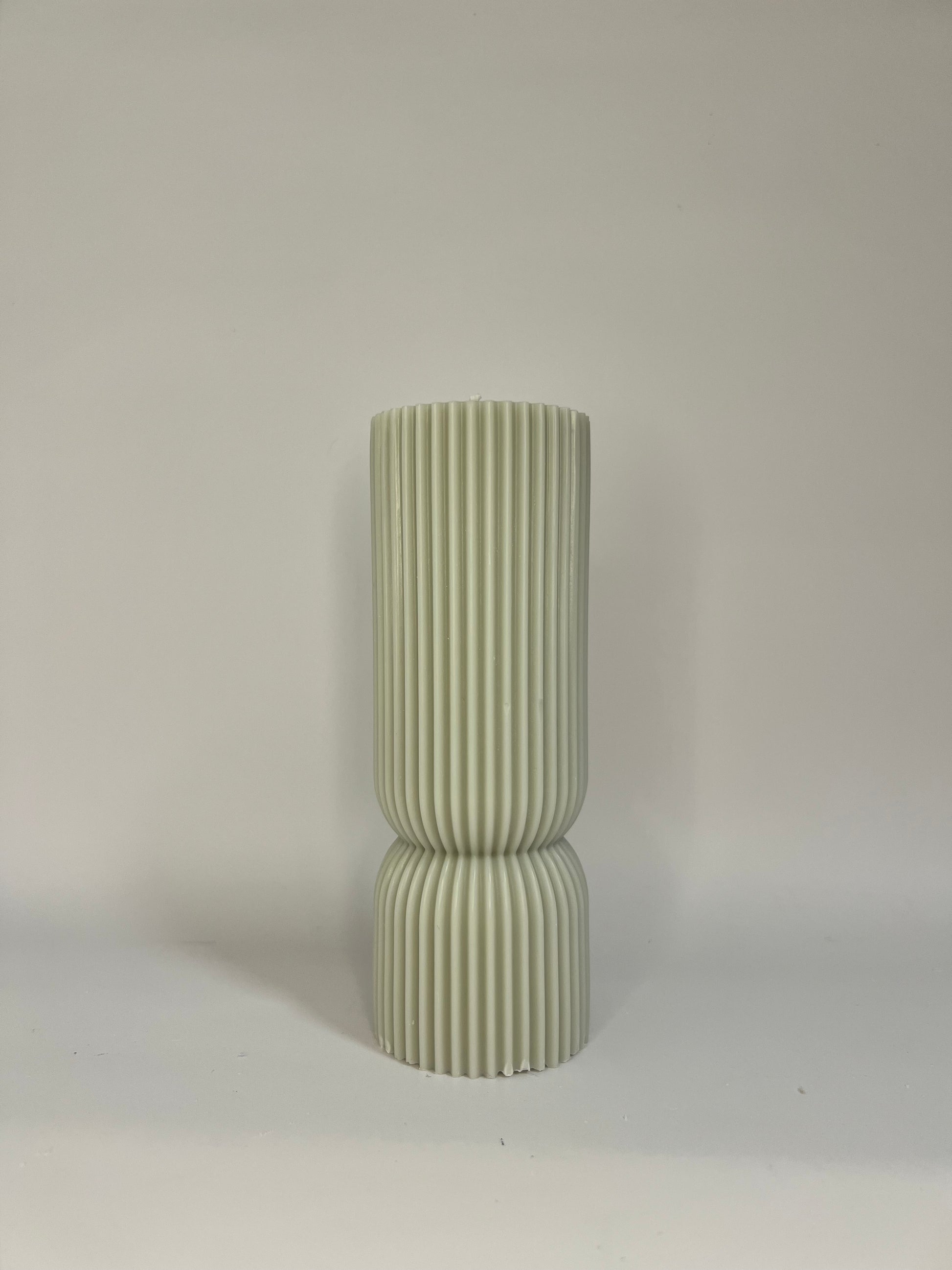 “Luxury soy wax candle trio with two book-shaped candles in beige and blue inspired by Baccarat Rouge 540, and one gray pillar candle with Millionaire Man scent – handmade sculptural candles for home decor and gifting