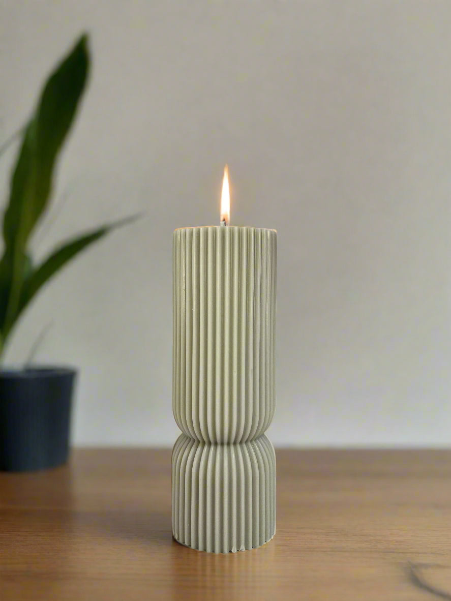 Decorative pastel candle with bold masculine fragrance, great for modern home styling and relaxation.